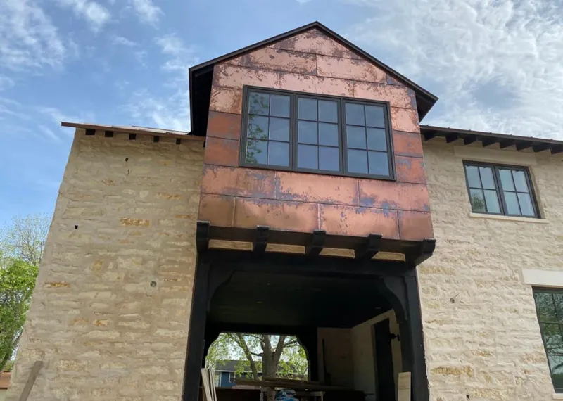 Copper metal panel facade on a stone building for Skylight Installation in Doylestown
