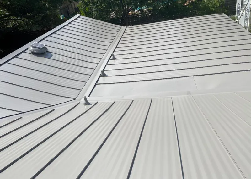 Solar attic fan installed on a metal roof for Roof Ventilation in Doylestown